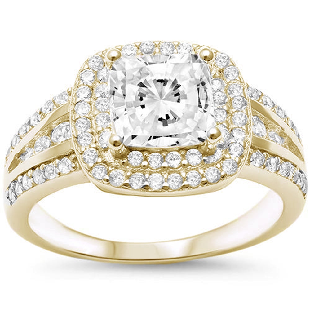 Features a dazzling 2 Carat princess cut ring
Intricate double halo of pavé stones down the band
Sterling silver with 14K gold plating
Available in sizes 4 through 11&nbsp;
Also available in silver