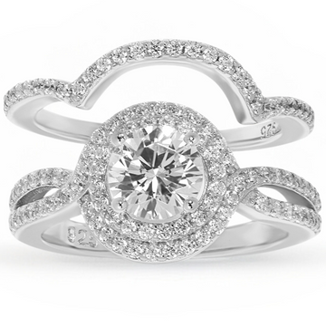 Features a 1-carat round cut center stone
Surrounded by an intricate double halo set in a stunning infinity band
Sterling silver and plated in Rhodium
Available in sizes 4 through 12