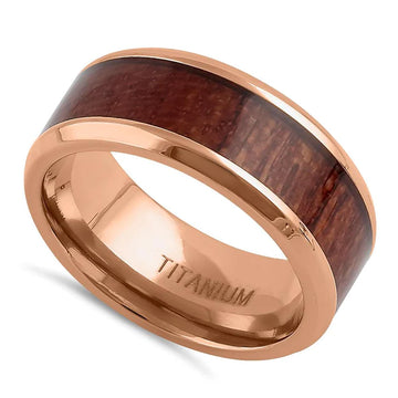 The perfect balance of style and substance for unique charm.&nbsp; Rose gold with wood inlay elevate this men's band.

Sleek 8.0mm band width and handcrafted Bubinga wood exterior
This titanium ring exudes unique charm
Rose gold plating and high polish finish