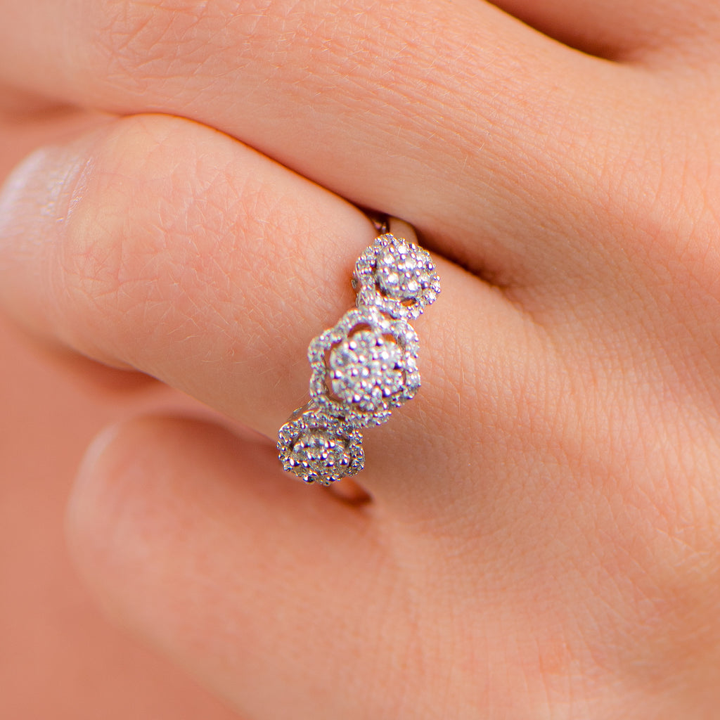 Floral-inspired ring boasts a .50-carat total weight of genuine diamonds
Stunning round stones are set in 14kt white gold, creating
The diamonds are of exceptional quality, rated as Color D.